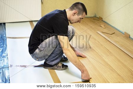 The Process Of Installing Laminate Wooden On The Floor