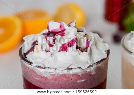 Milkshake shot close-up on a wooden background in the decoration