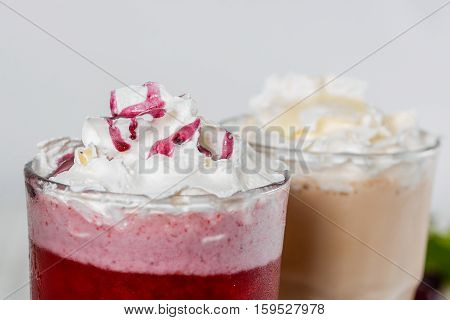 Milkshake shot close-up on a wooden background in the decoration