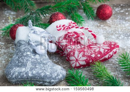 Christmas Stockings On Snowbound Wooden Background With Red Balls Ornament