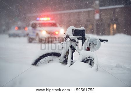 Snow storm in the city. Police car run on emergency call during snow storm in New York City.