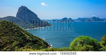 View of Sugarloaf Mountain from Forte do Leme. Sugarloaf peak situated at the mouth of Guanabara Bay on a peninsula that juts out into the Atlantic Ocean, Rio de Janeiro, Brazil