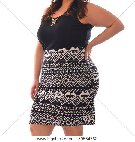 portrait of plus size model woman wearing XXL black t-shirt and skirt posing isolated on white background.