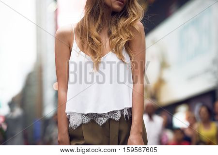 Beautiful fashion girl wearing white cotton top and gey pants outfit