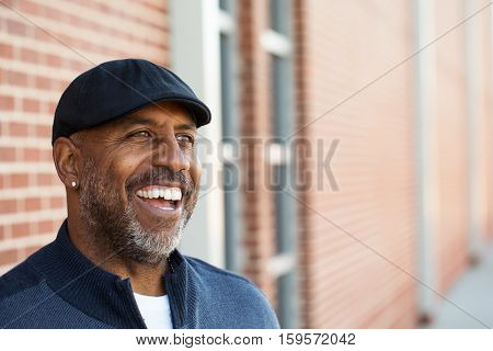 Portrait of an African American sitting outside.