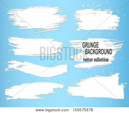 White brush strokes on a blue background ink brush strokes brushes lines. Dirty artistic design elements boxes frames.