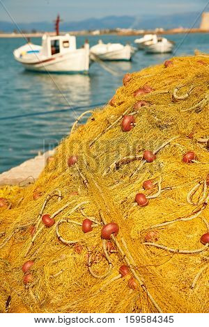 Pile Of Yellow Fishing Nets In Port