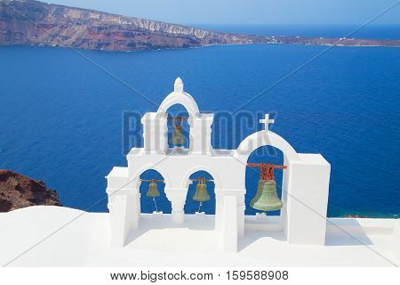 bwhite church bells, eautiful sights of Santorini island