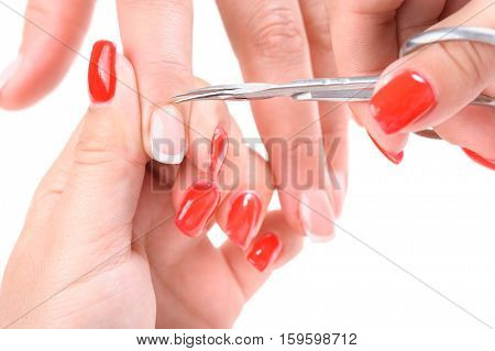 Nail salon, hands beauty treatment, cuticles cutting with cuticle pusher