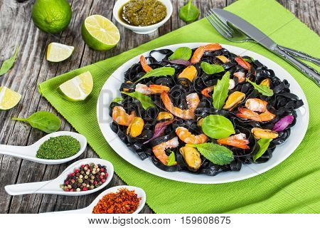 Black Noodles Salad With Prawns, Mussels, Fresh Green Herbs