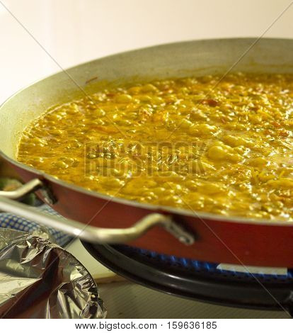 Seafood fideua finishing cooking. Pasta. No people