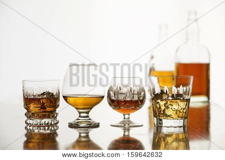 Whiskey bourbon cognac and brandy on white