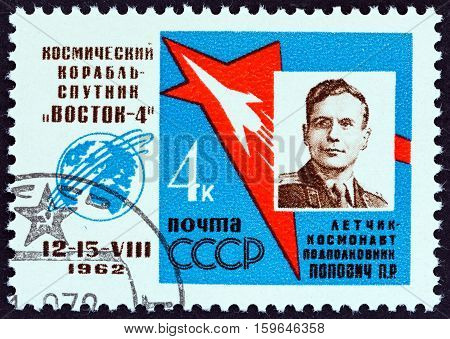 USSR - CIRCA 1962: A stamp printed in USSR from the "First Group Space Flight " issue shows cosmonaut Pavel Romanovich Popovich, circa 1962.