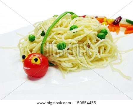 creative spaghetti food garnish with sausage ladybug shape