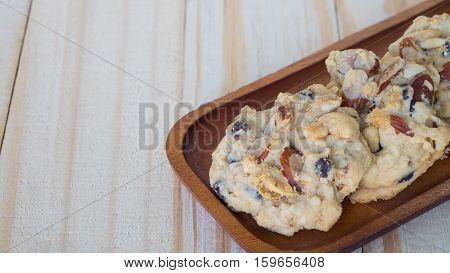 Nut cookies on wooden tray. Chocolate cookies on wooden table.cashew nut on wooden table.