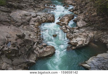 blue mountain river rocks on stone background