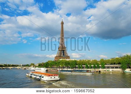 Eiffel Tower With Touristic Boat On Seine