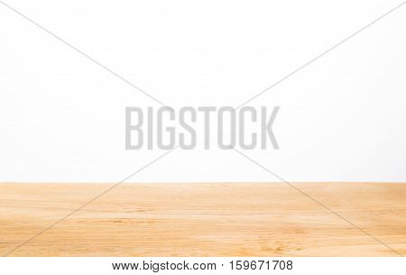 light color wood table top against white background selective focus on center of the wood table with blurred foreground and background