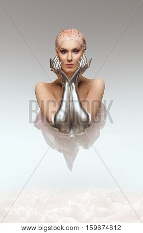 Fantasy portrait of beauty cyber woman from the future with clay hairstyle and silver hands above clouds