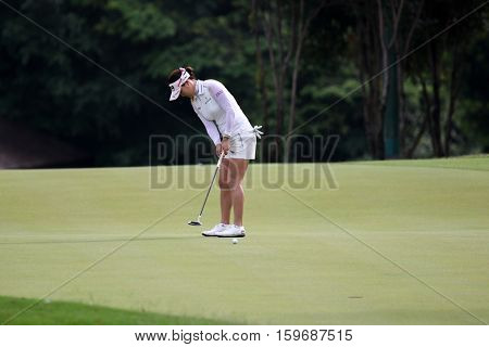 KUALA LUMPUR, MALAYSIA - OCTOBER 29, 2016: So Yeon Ryu of South Korea putts on the green at the TPC Golf Course at the 2016 Sime Darby LPGA Malaysia golf tournament.