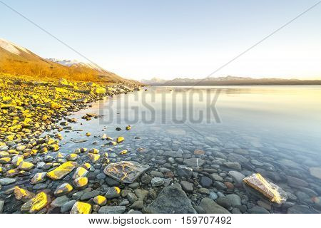 Lake stone and rock during sunrise moment