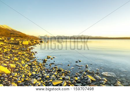 Lake stone and rock during sunrise moment