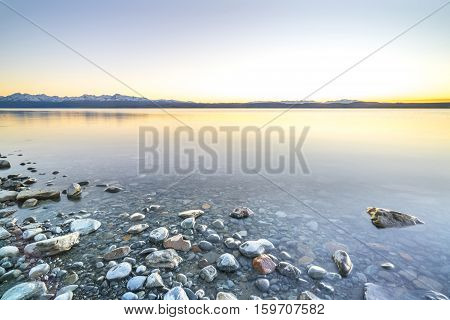 Lake stone and rock during sunrise moment