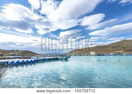Salmon Fish farm floating on the glacial waters of Wairepo Arm Twizel South Island New Zealand