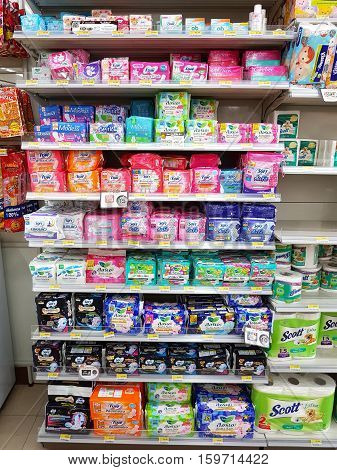 CHIANG RAI THAILAND - NOVEMBER 26: various brand of Sanitary napkins in packaging for sale on supermarket stand or shelf in Seven Eleven on November 26 2016 in Chiang rai Thailand