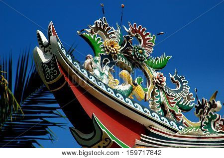 Bang Pa-In Thailand - December 27 2005: Roof carvings on a flying eave roof of the Chinese Pavilion Phra Thinang Wehat Chamrun the Summer Royal Palace
