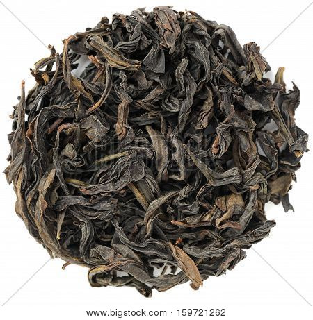 Tie Lo Han Iron Arhat Wuyi Shan roasted ooloong tea in round shape isolated overhead view