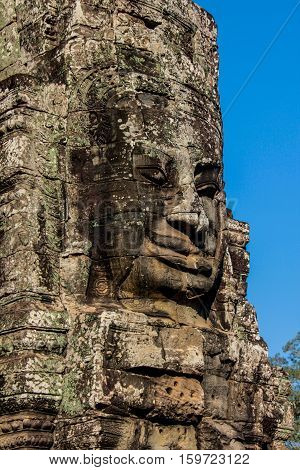 Faces statue landmark in Angkor Wat in Cambodia