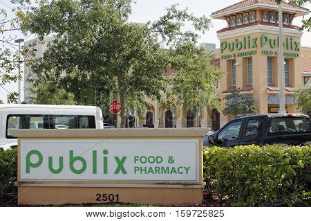 Fort Lauderdale FL USA - April 30 2016: Two Publix Food & Pharmacy signs with a Publix grocery store. Publix grocery signs and supermarket on a sunny day