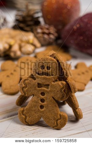Christmas smiling gingerbread men men and women on rustic wooden background