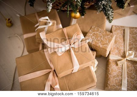 New year. Christmas gifts Packed in craftool paper. A sense of celebration