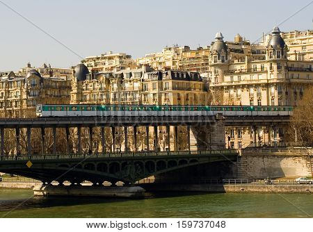 Parisian Metro Train On The Bir-hakeim Bridge Over The Seine (line 6)
