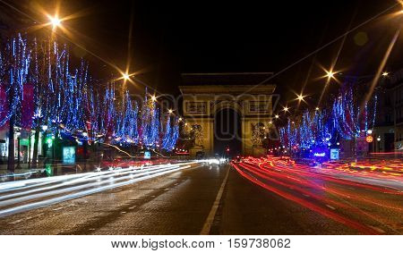 Night View Of The Champs-elysees With Christmas Illumintation And The Arc De Triomphe In Paris, Fran