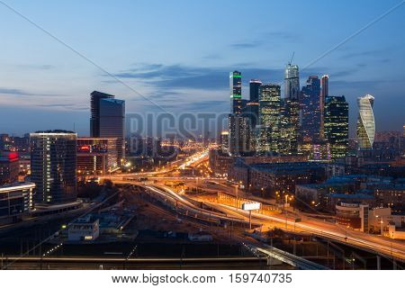 MOSCOW - APR 8, 2016: Futuristic Moscow International Business Center (MIBC) under construction and highway at evening. East tower of complex Federation in height 374 m - highest skyscraper in Europe