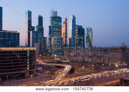 MOSCOW - APR 12, 2016: Moscow International Business Center (MIBC) and highway at evening. East tower of complex Federation in height 374 m - highest skyscraper in Europe