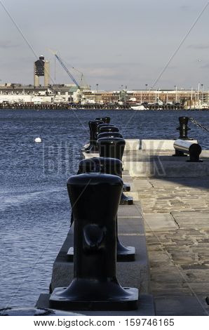Irregular line of bollards edging the Boston Harborwalk