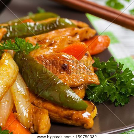 Chicken and Rice with Vegetable Spicy Sesame Teriyaki Wok Sauce. Selective focus.