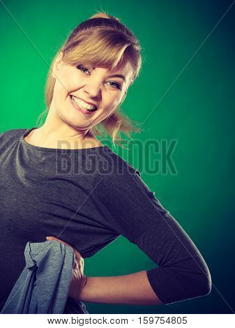 Chores housework silly hygiene clean concept. Blonde maid enjoying her work. Young girl dancing waving around dirty rag cleaning.