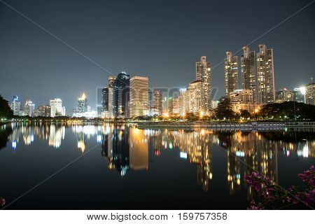 modern night cityscape in Benchakitti Park thailand