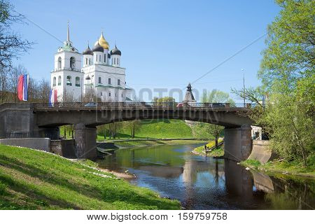 View on the old Sovetsky Bridge and old Trinity Cathedral in the sunny May afternoon. Pskov Russia