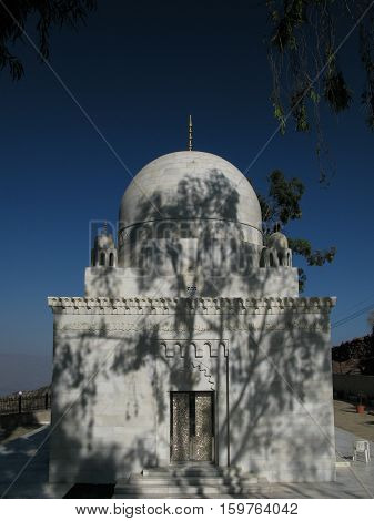 The tree shadow on the mustaali mausoleum Hoteyb Yemen