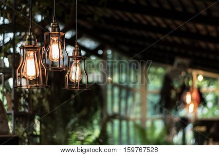 beautiful Light bulb incandescent hanging decorated interior roomselective focus.