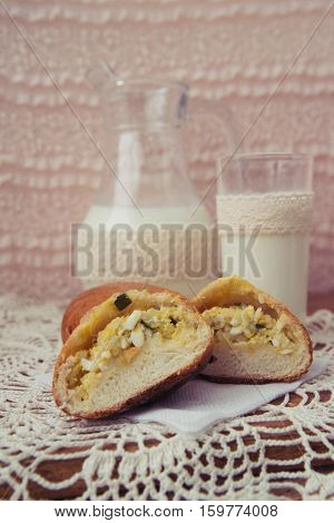 fresh pies with milk on light background