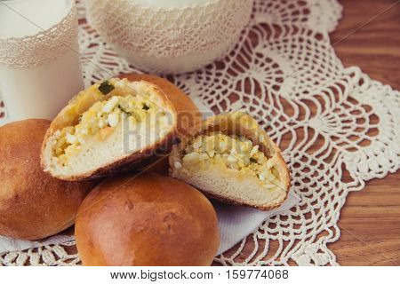 fresh pies with milk on light background
