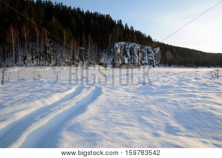 Winter view of the cliff "Shaitan Rock" on the Chusovaya River.