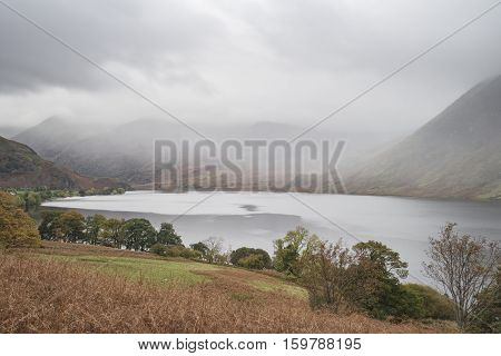 Beautiful Autumn Fall Landscape Image Of Crummock Water At Sunrise In Lake District England
